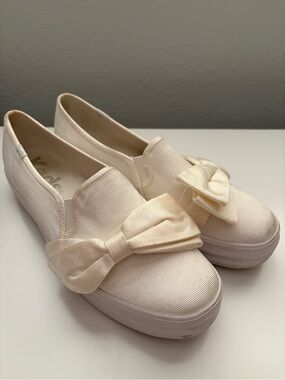 Keds Cream Slip-On Sneakers with Bow Accent